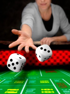 gambler playing dices at casino